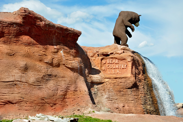 bear statue and waterfall